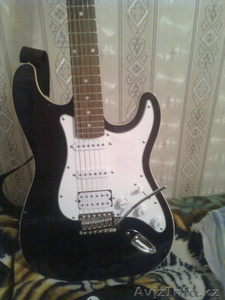 родам фирменную Электрогитару Groovin #68489