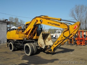 HYUNDAI -1300W,  65000$ 2003г.в., колесный экскаватор ,  ковш 0, 71 м.куб., отвал #242741