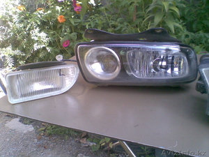 Subaru Legaсy,  противотуманка левая,  бочок расширительный,  замок капота #1115288