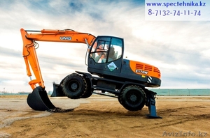 Экскаватор на пневмоколесном ходу #1240283