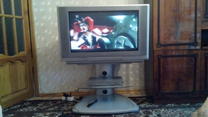 Телевизор Panasonic  с стеклянной подставкой #1251445